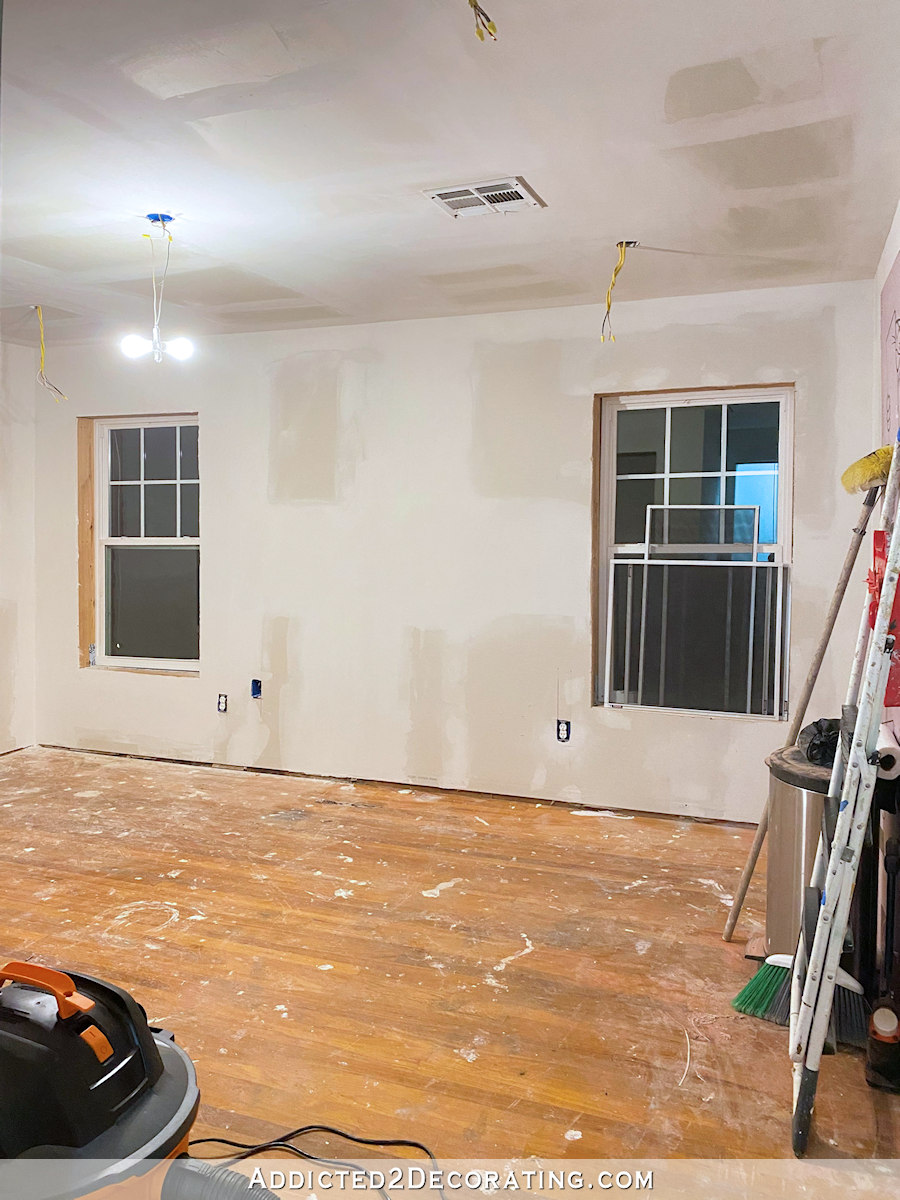 home gym during remodel with new drywall and windows