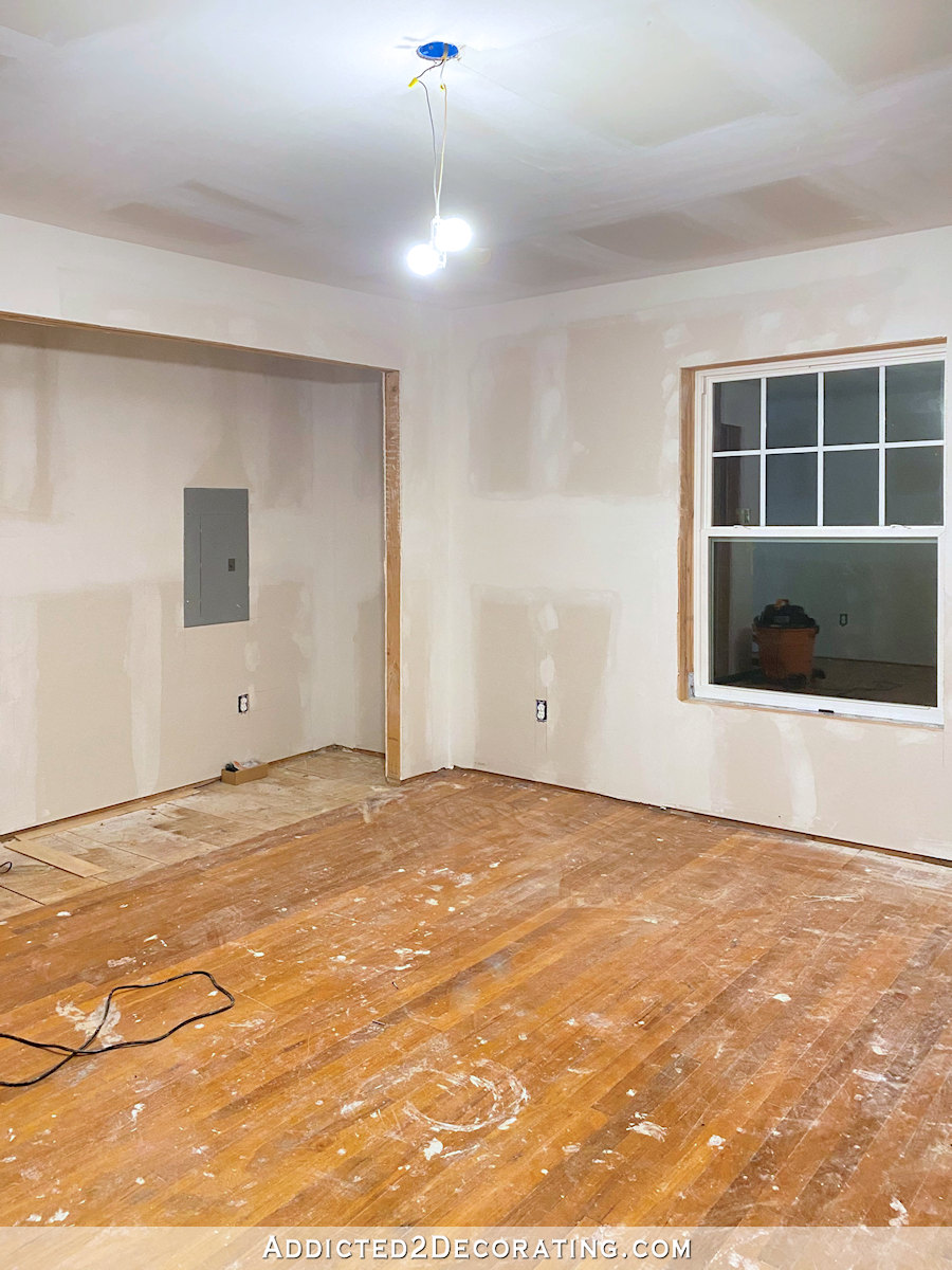 home gym during remodel with new drywall and window, closet area opened up