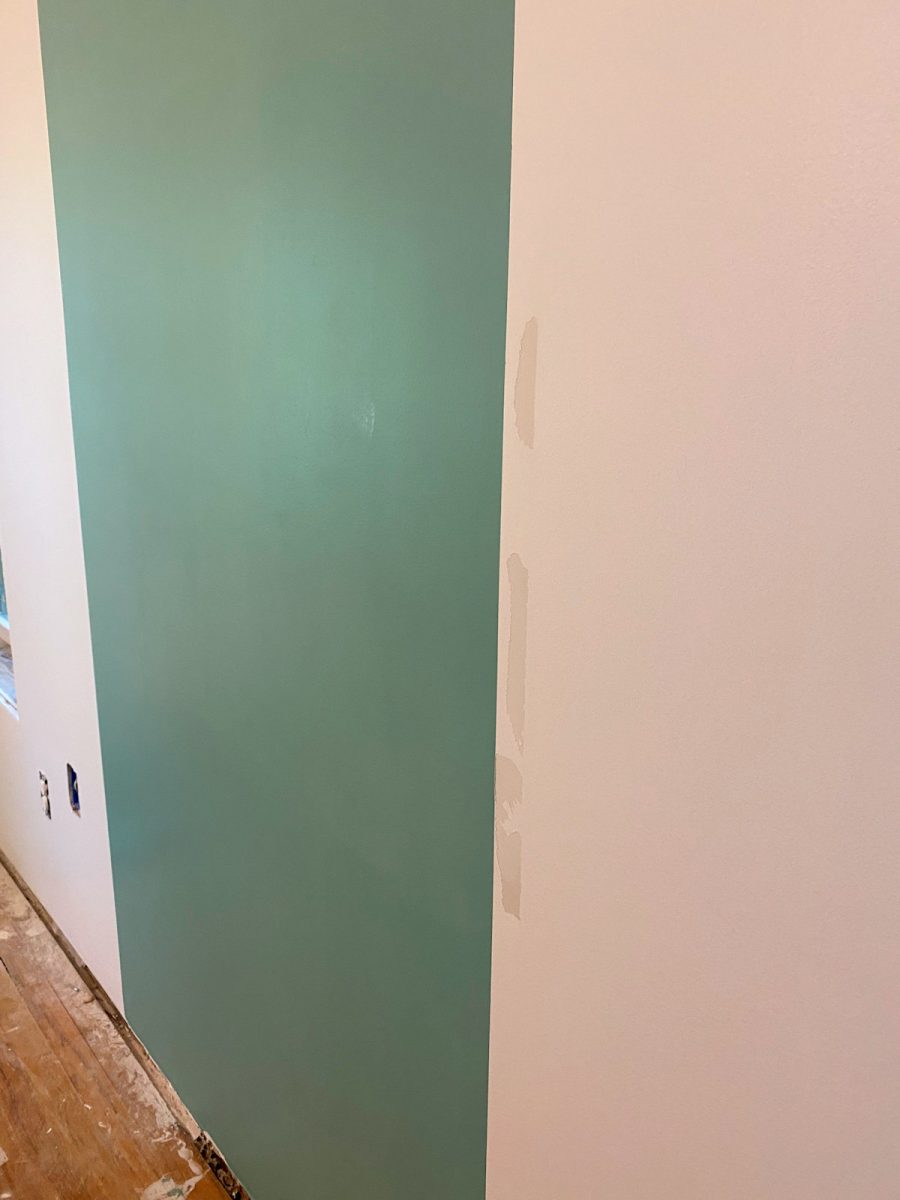 home gym - walls with first color - painters tape ripped paint off of the wall
