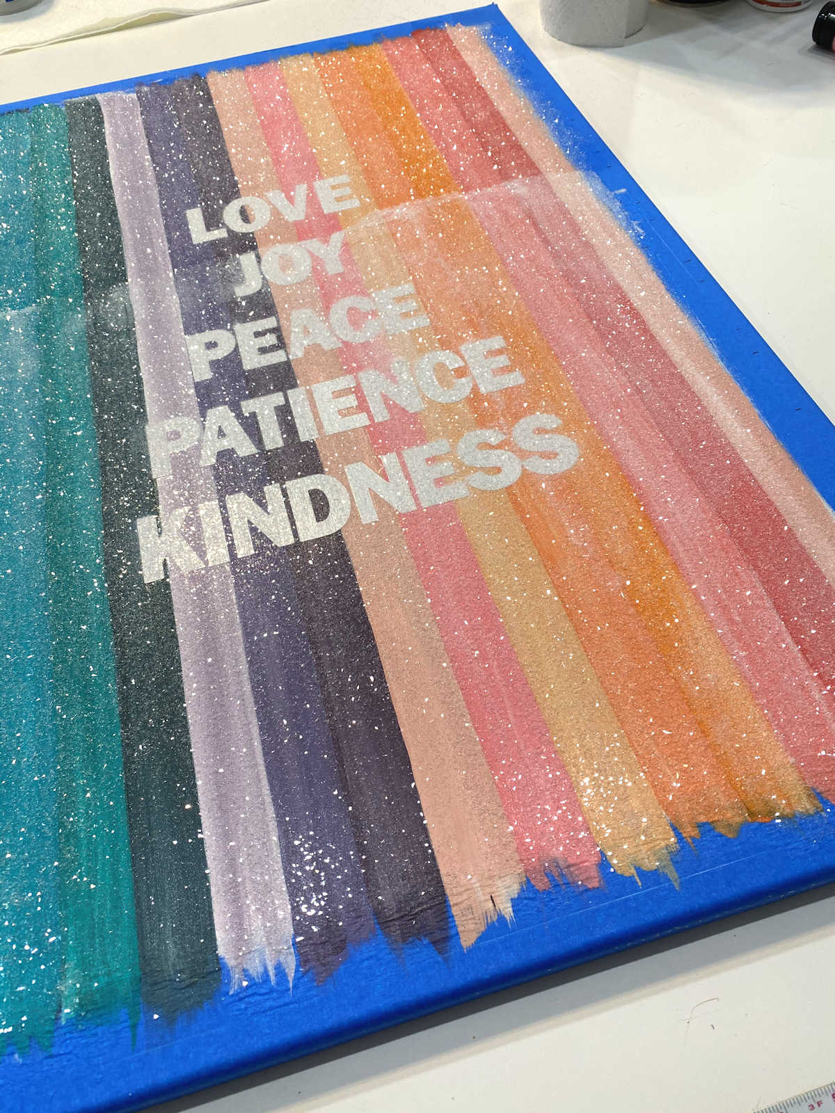 DIY colorful cut glass glitter word art- step 5 - spread Mod Podge over entire canvas and add cut glass glitter