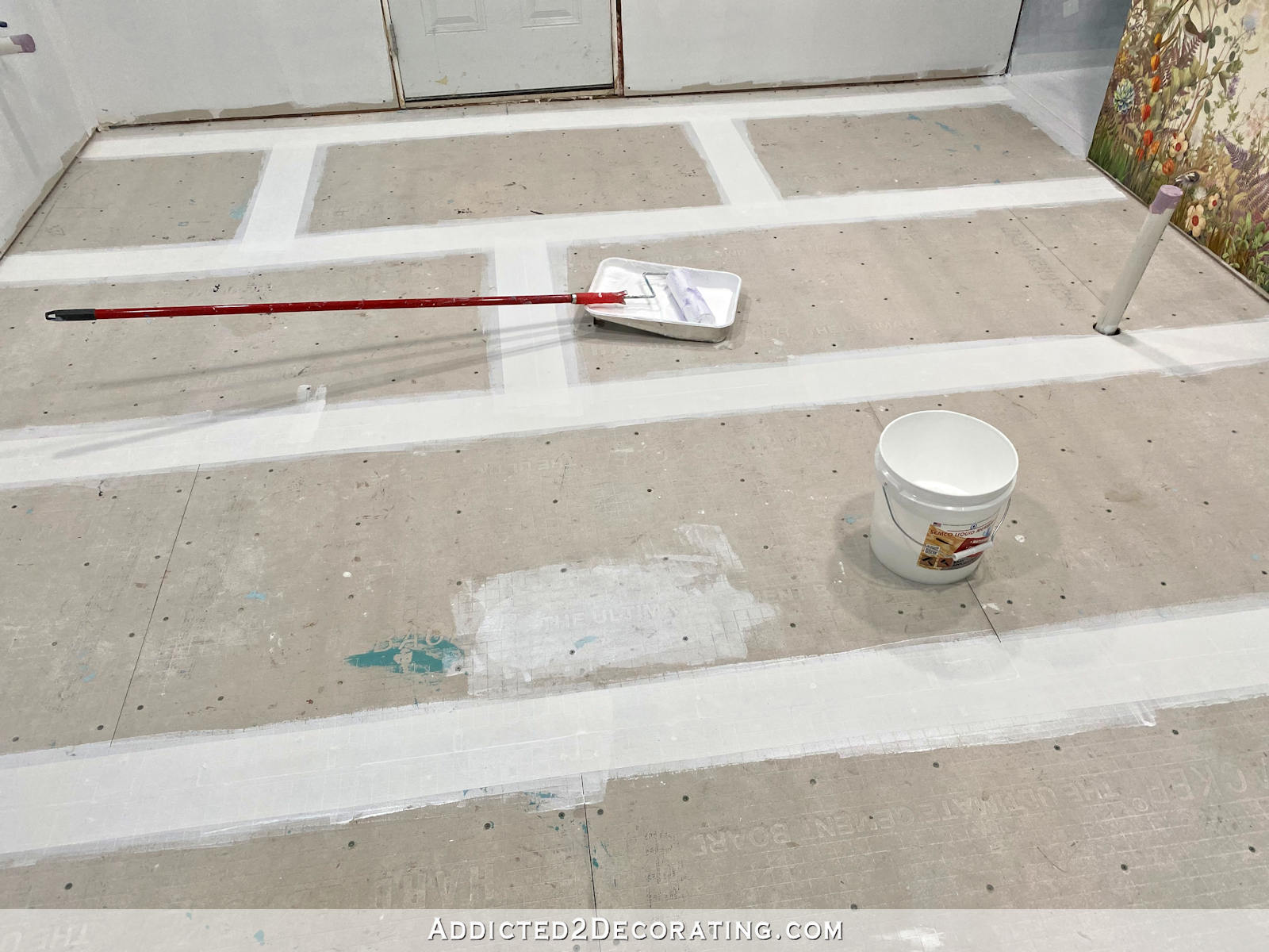 coating bathroom floor joints with Semco waterproofing and crack prevention liquid membrane