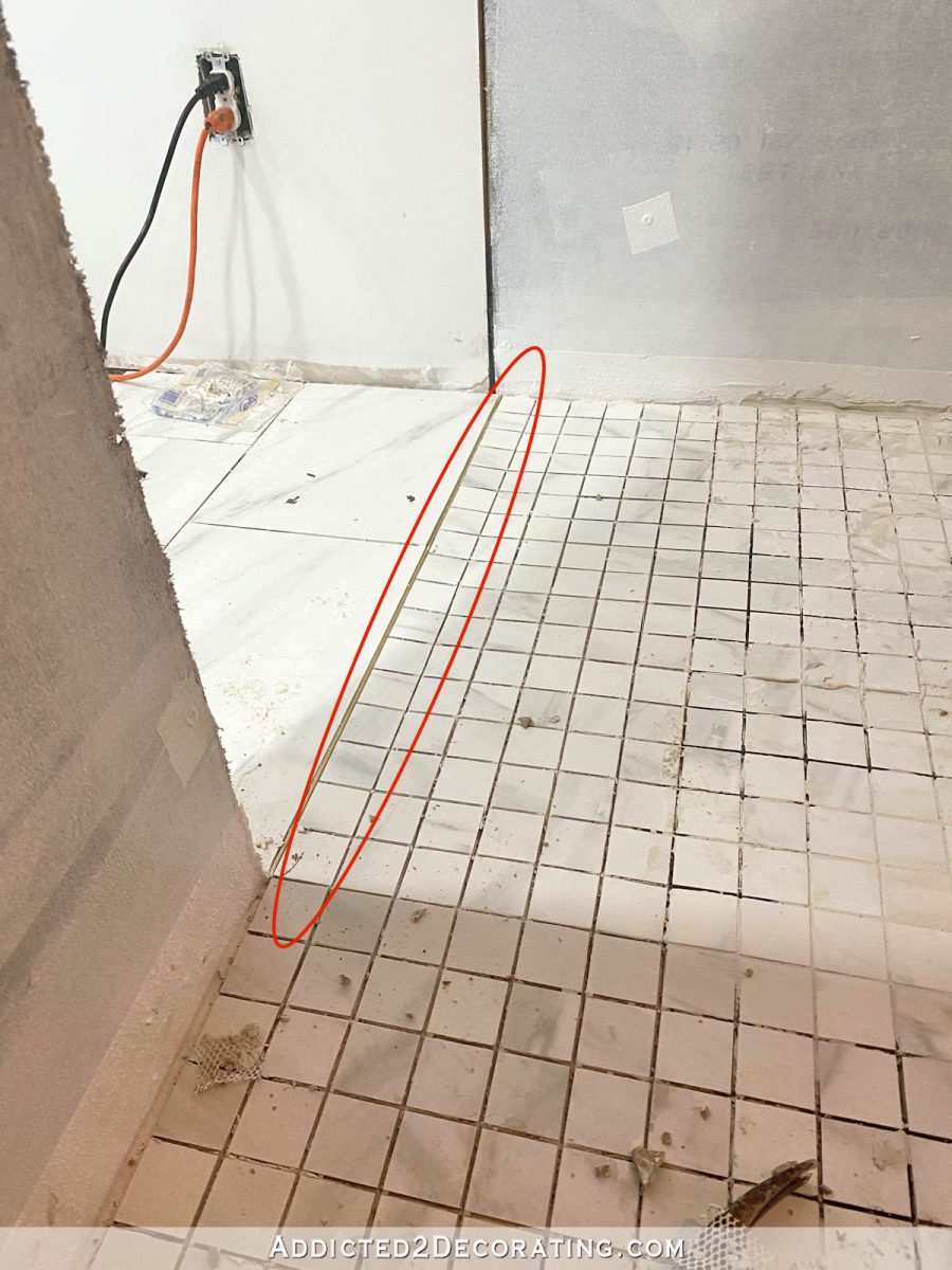 2 x 2 tiles on shower floor installed incorrectly