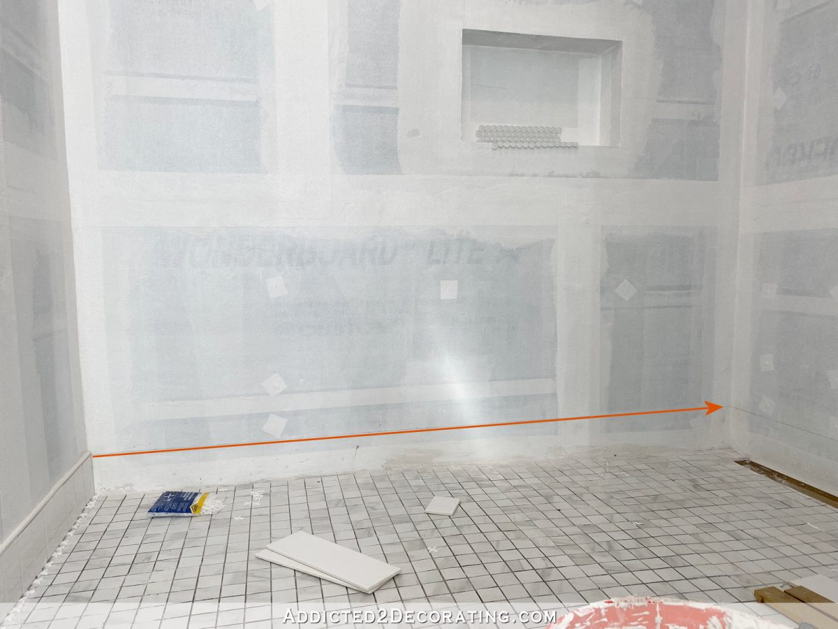 tiling the bottom of shower walls with a sloped shower floor - 2