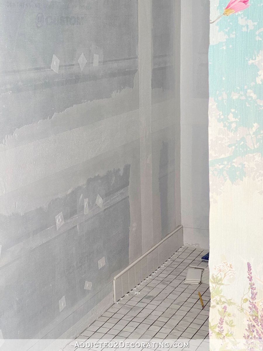 tiling the bottom of the shower wall with a sloped shower floor - 3