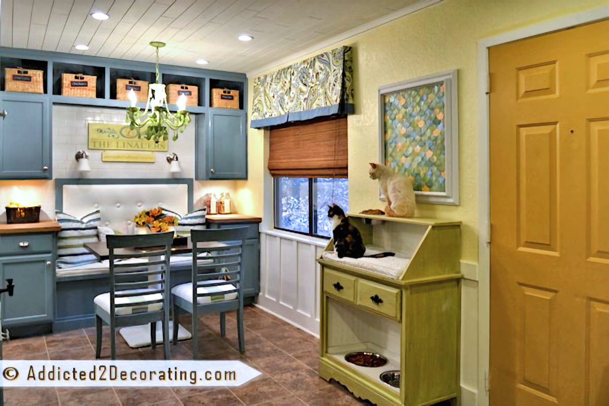 Colorful condo breakfast room with built-in banquette seat