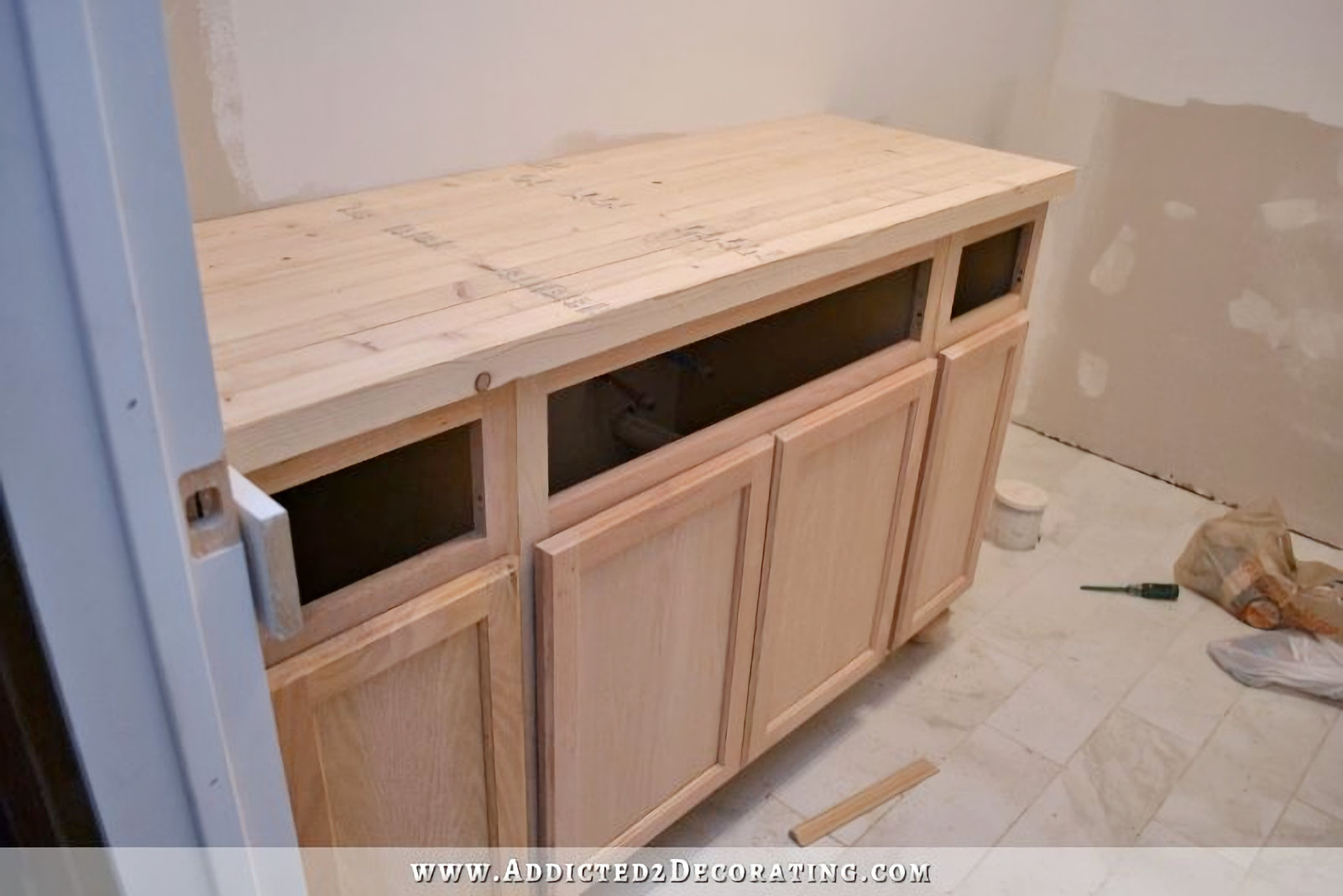 DIY butcherblock countertop cut to size and in place on bathroom vanity