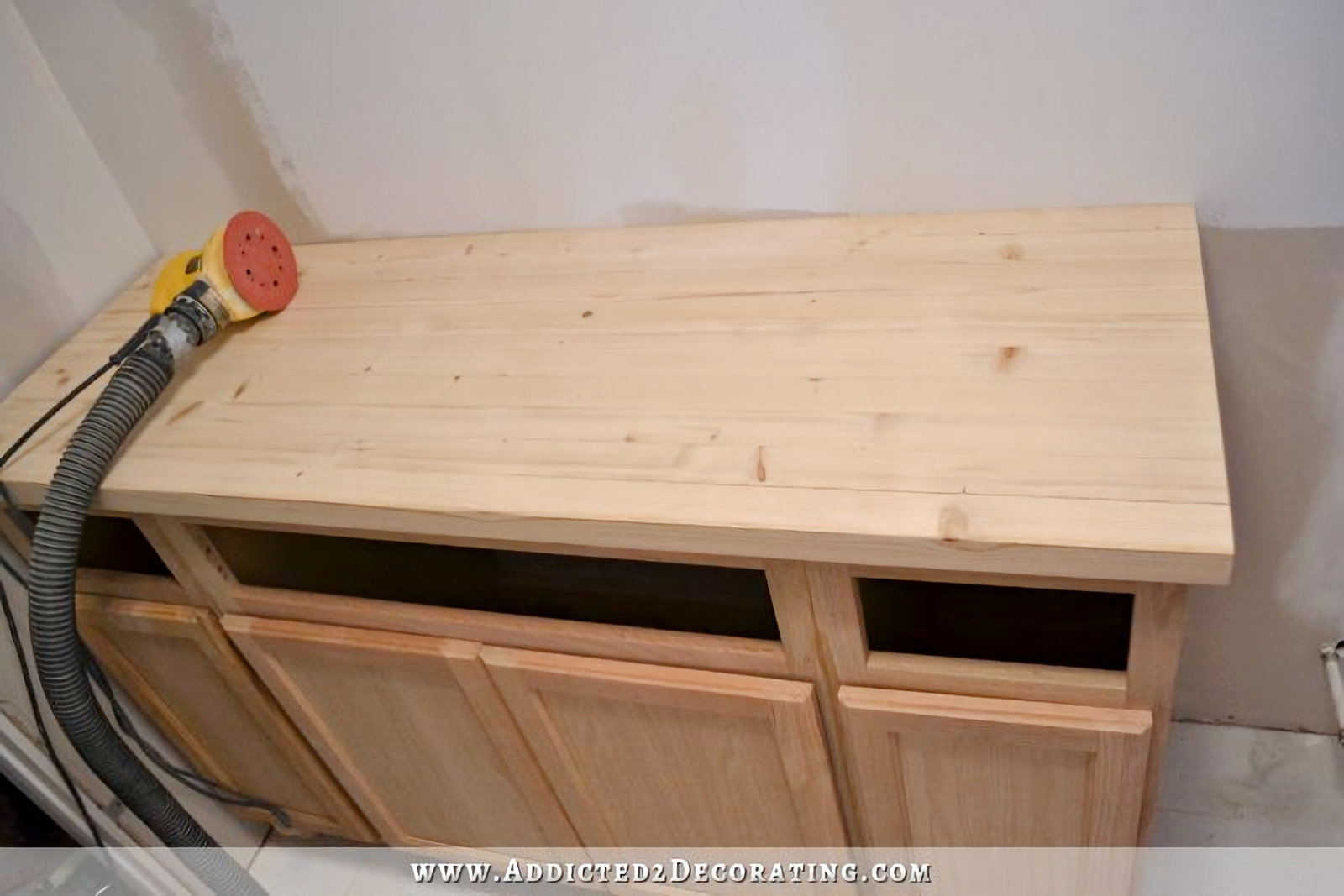 DIY pine butcherblock countertop after initial sanding with 60-grit sandpaper