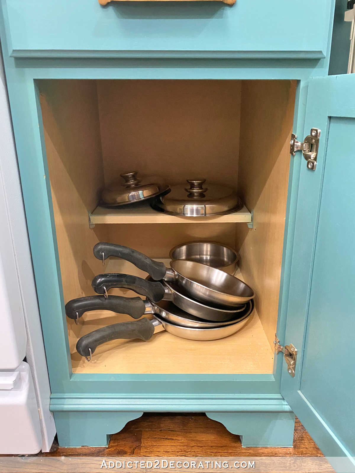 my kitchen cabinet skillet storage before organizing