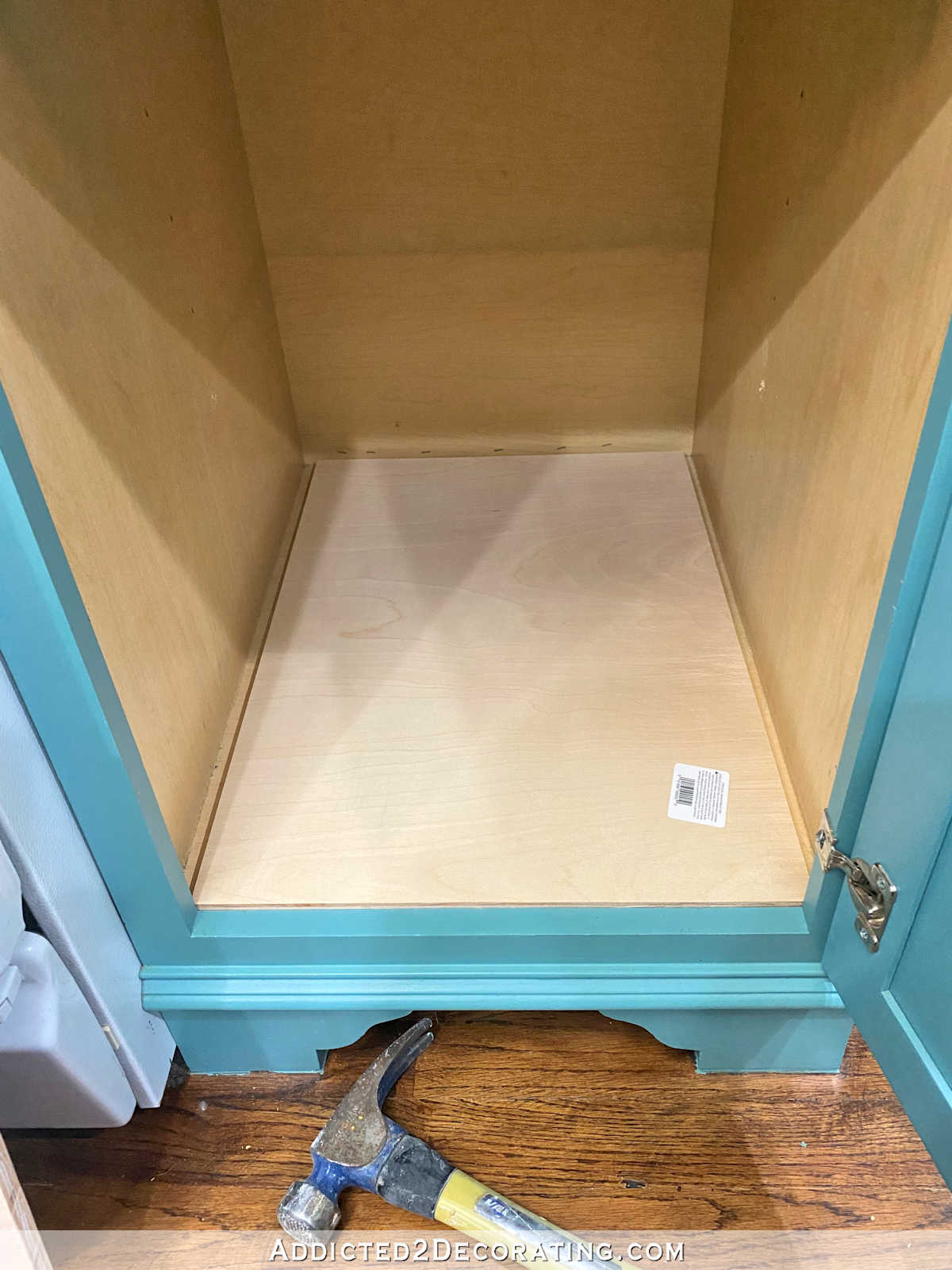 DIY kitchen cabinet organizer - step 1 - cut 1/2-inch plywood for bottom