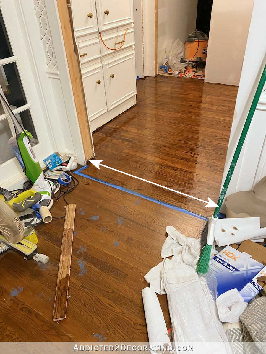 refinishing hardwood floors one room at a time -- use painters tape to tape off one room from another along the edge of a floor board