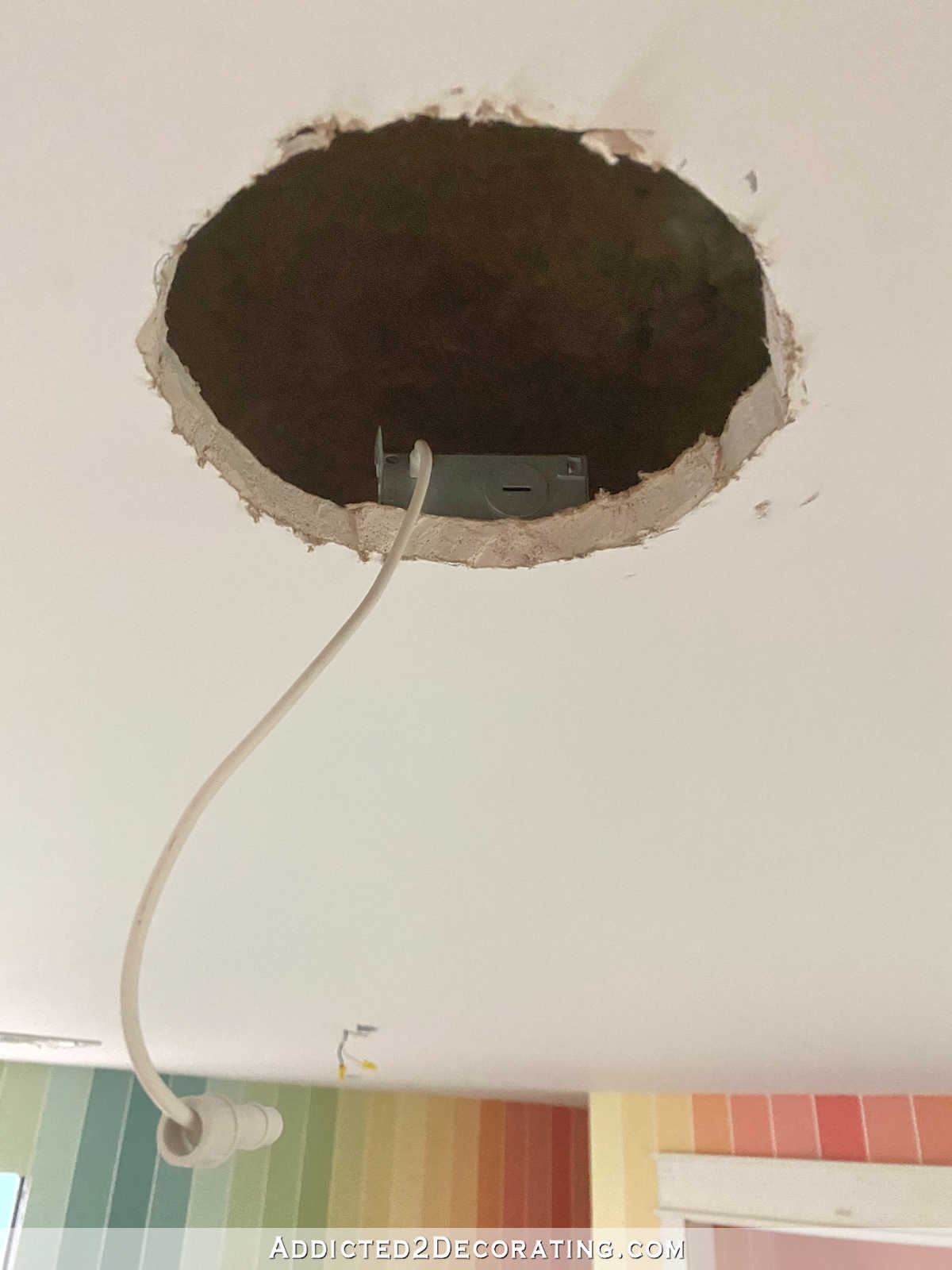 connection box for canless ultra thin recessed light sits on top of drywall in attic
