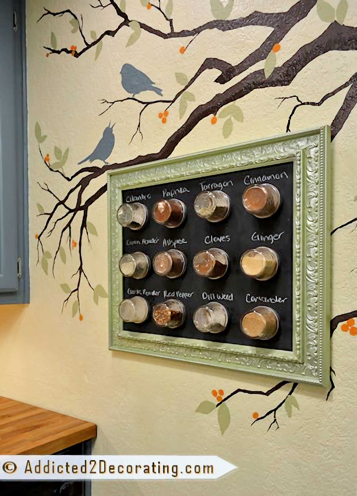 DIY magnetic spice rack hanging on kitchen wall