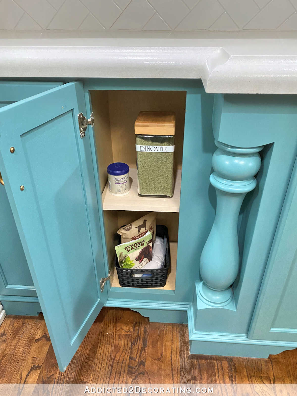 kitchen cabinet after organization - dog treats and food storage