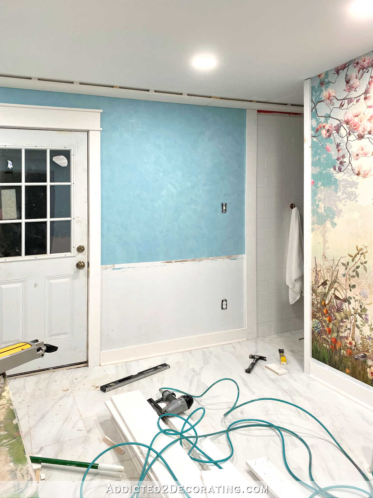 master bathroom remodel with teal Venetian plaster walls and wallpaper mural