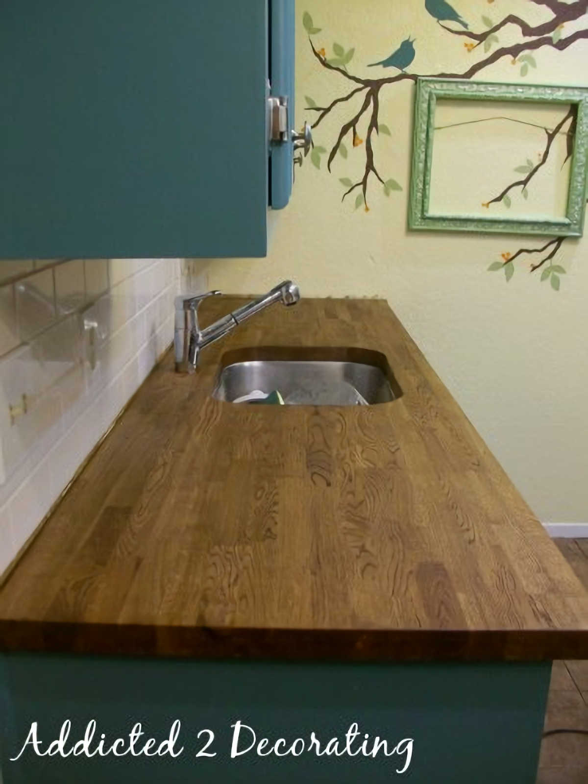 stained and sealed butcher block countertop with undermount sink