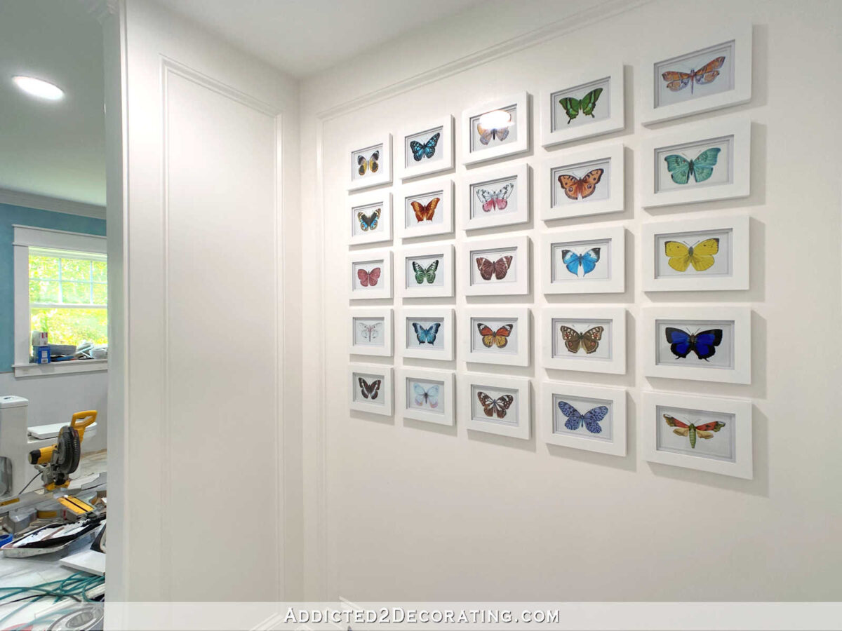 Finished grid gallery wall with 25 butterfly illustrations