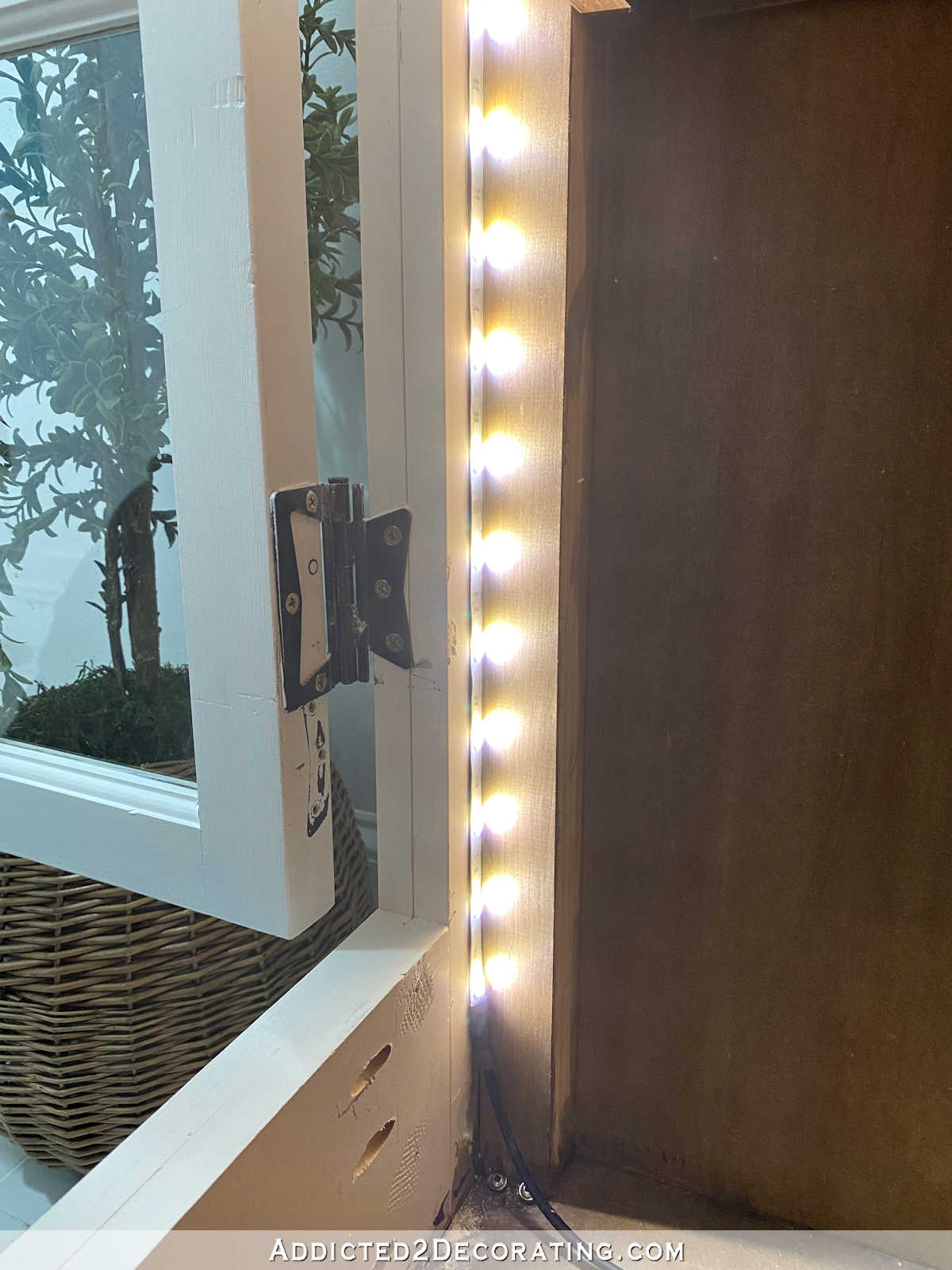 Adding LED tape lights to a glass front cabinet