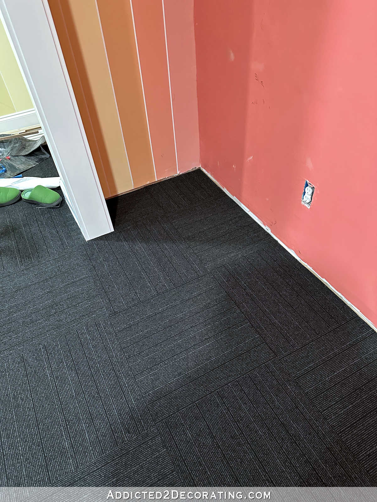 FLOR Rush Street carpet tiles in black used on a home gym floor