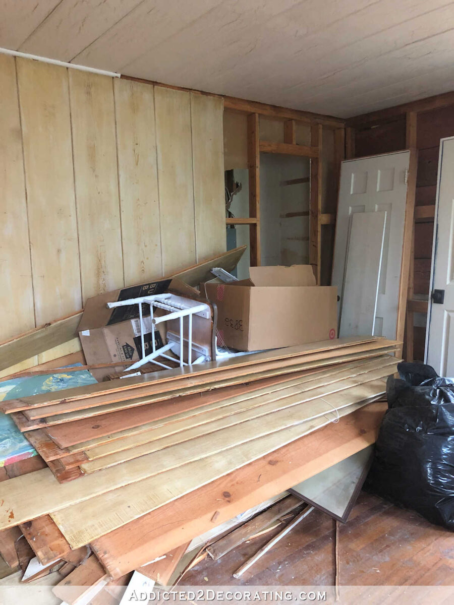 home gym during remodel - removing real shiplap from walls