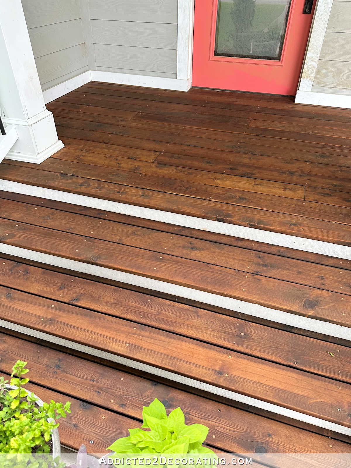 Cedar wood on the front porch was stained and sealed with Ready Seal in Dark Walnut