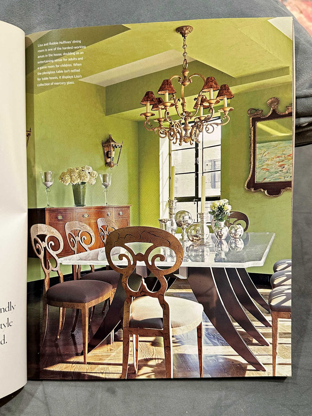 Dining room with chartreuse walls, metal and glass dining table, scrolled wood chairs, from 2006.  