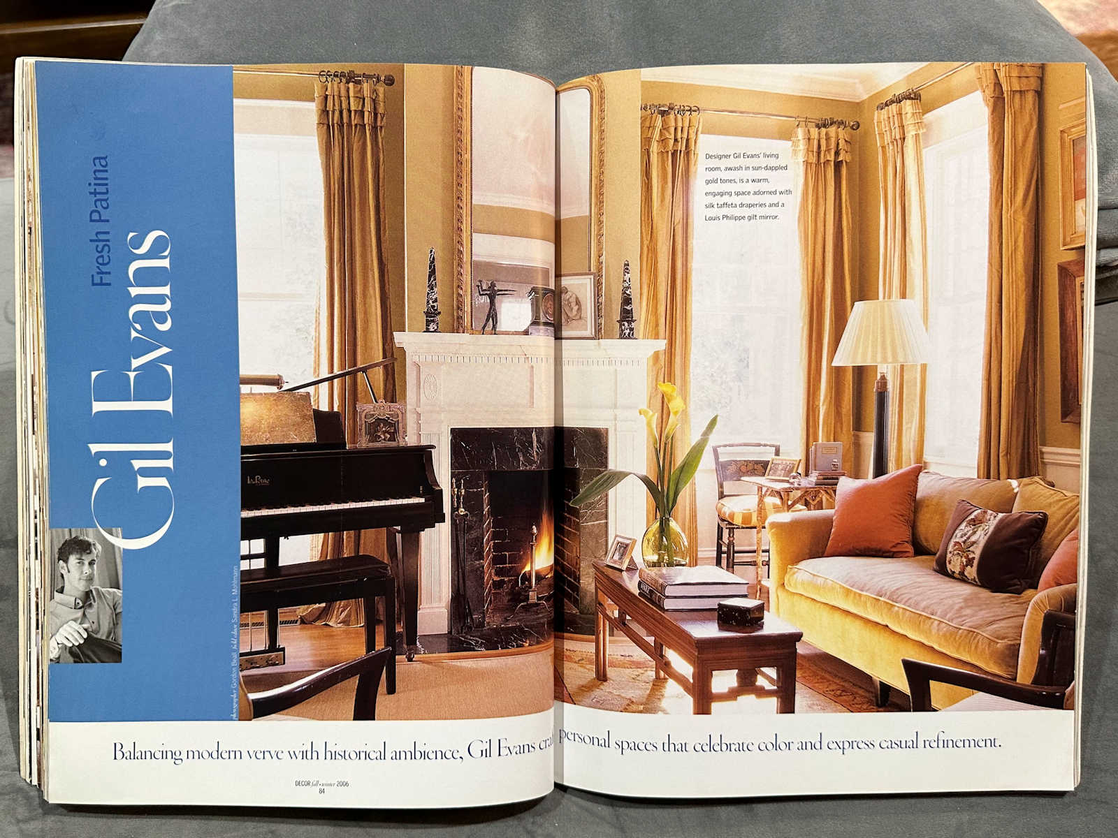 Living room with golden yellow curtains, walls, and sofa, black baby grand piano, white stone fireplace from 2006. Is there such a thing as timeless living room design?