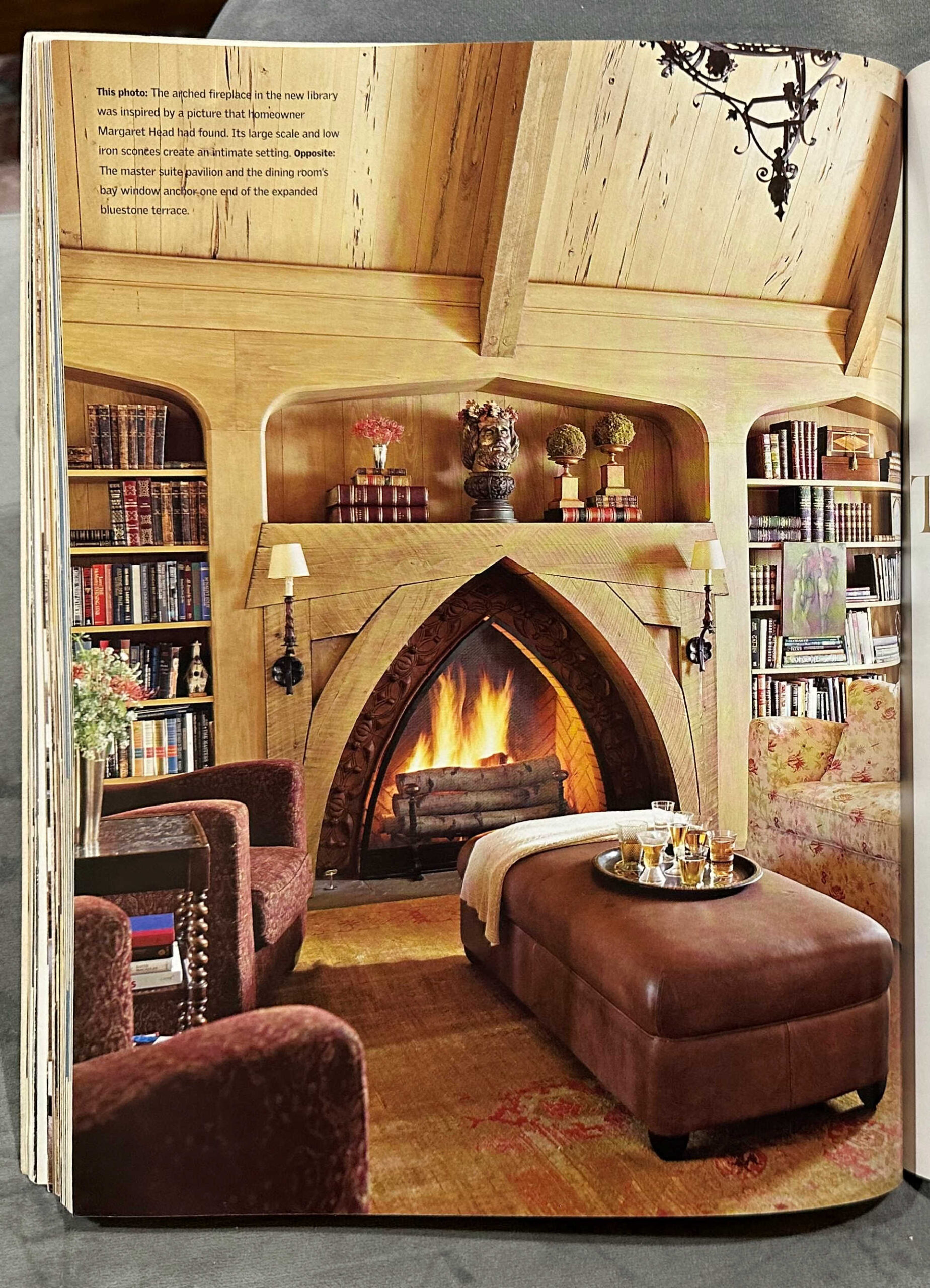 Unique cathedral window shaped fireplace in cottage style living room