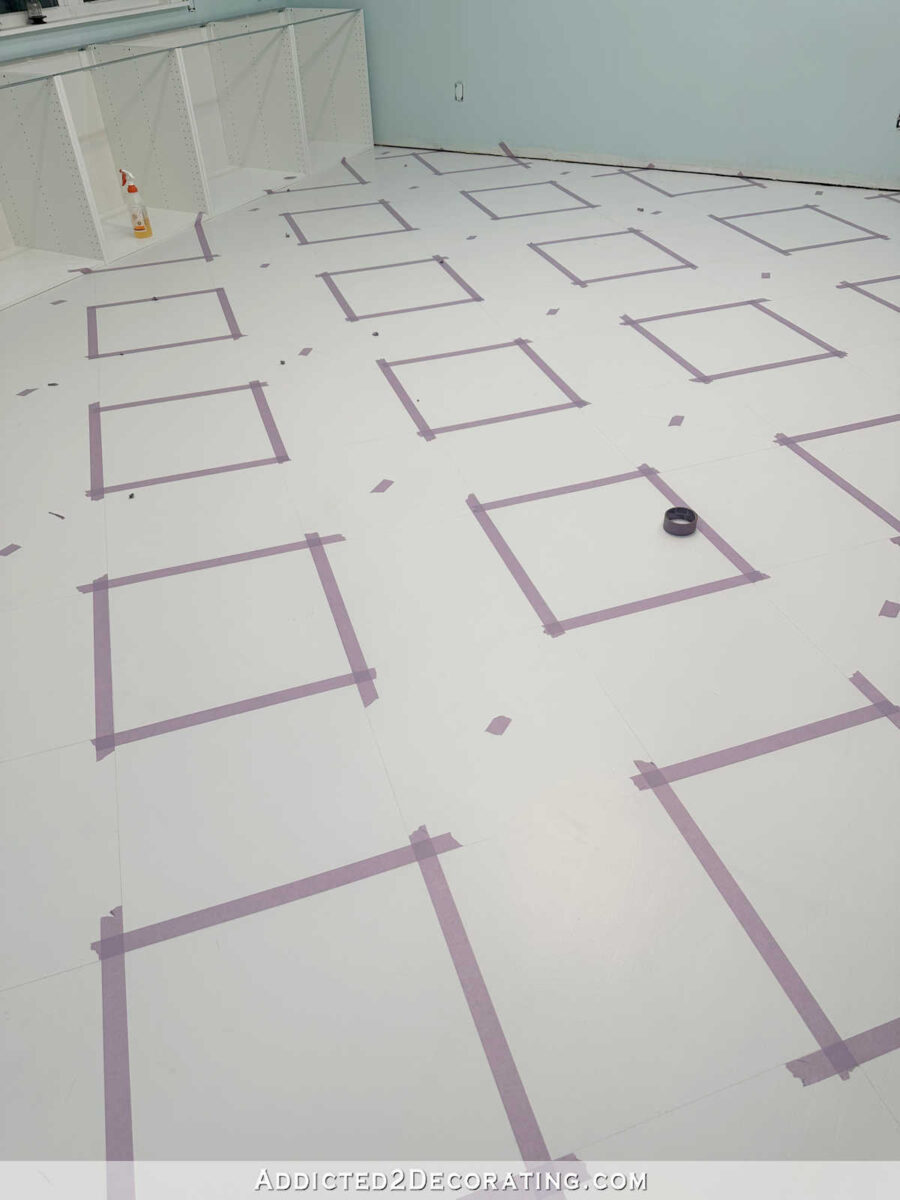 taping off a checkerboard floor design on a hardwood floor