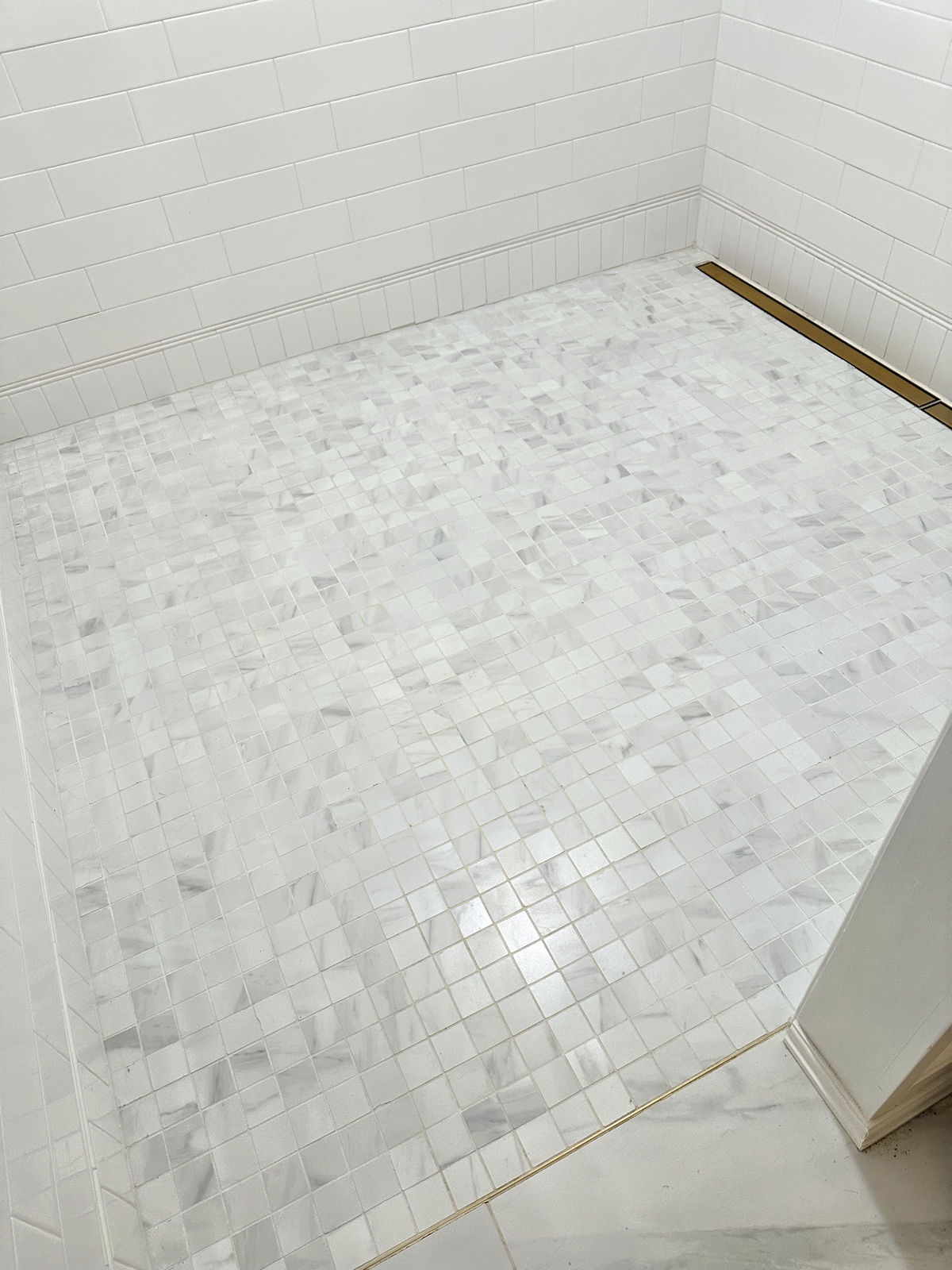 The Easiest No-Scrub Way To Clean White Grout In A Shower