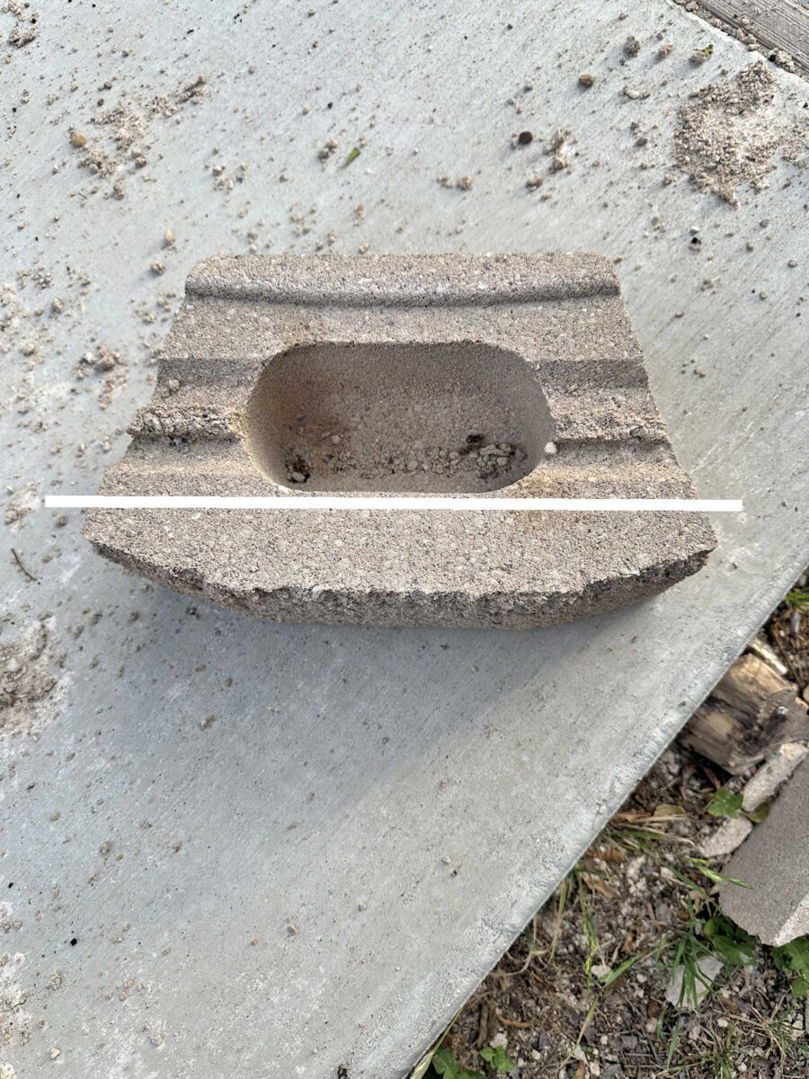 Idea for creating stone facade skirting on concrete porch using retaining wall blocks