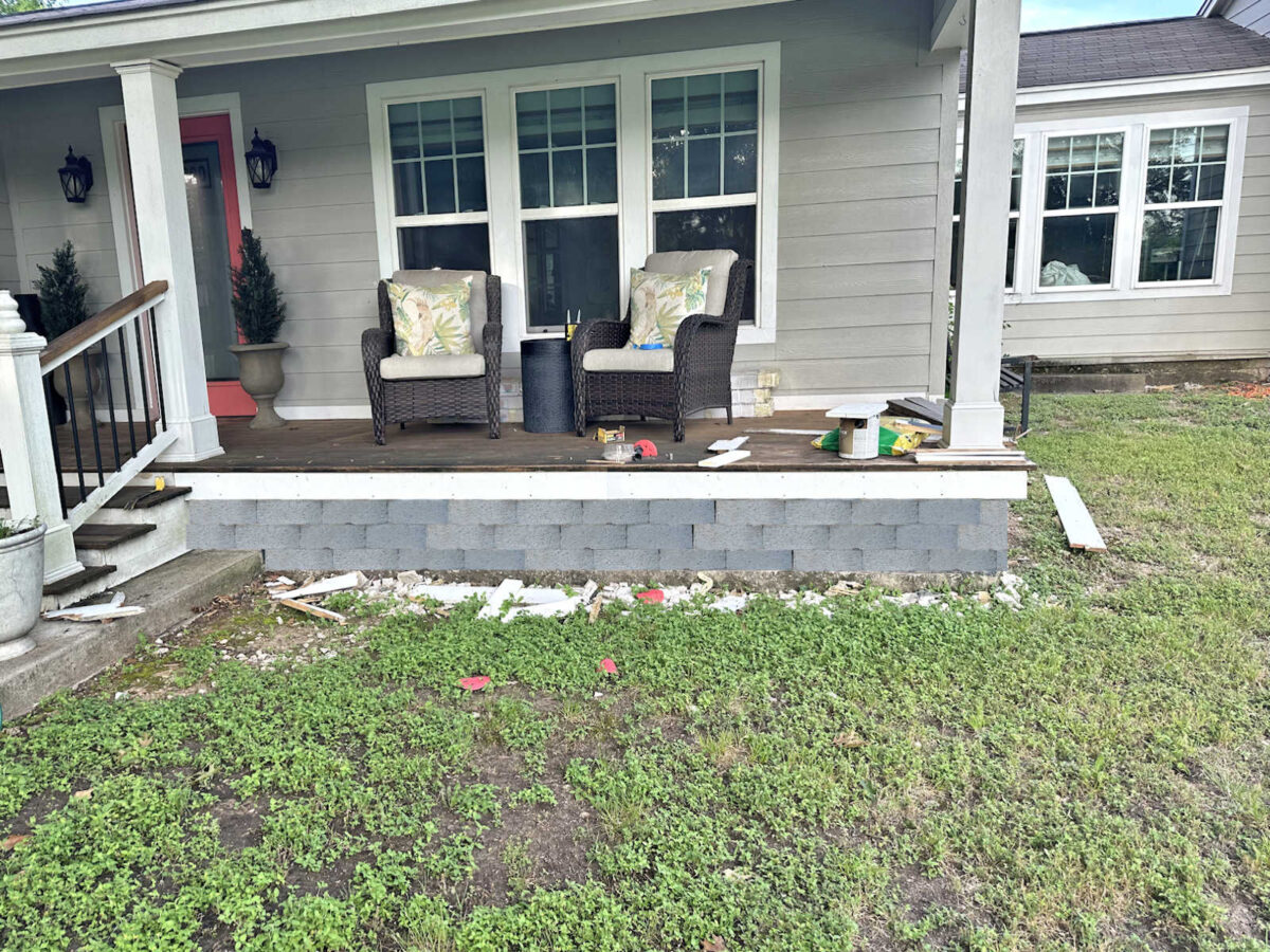 mockup of concrete porch with floating wood porch and retaining wall block skirting