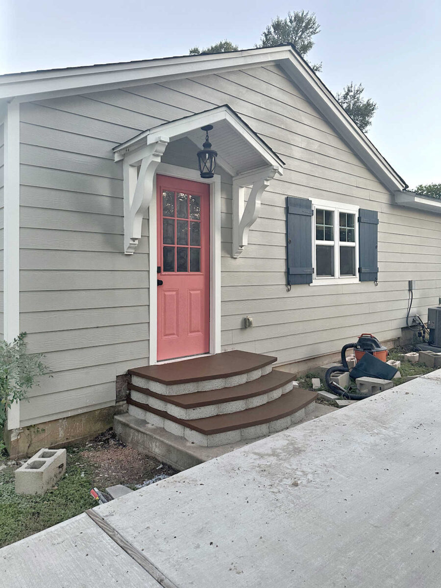 Exterior door with DIY concrete steps made from retaining wall blocks and concrete pavers -- How I painted exterior concrete steps
