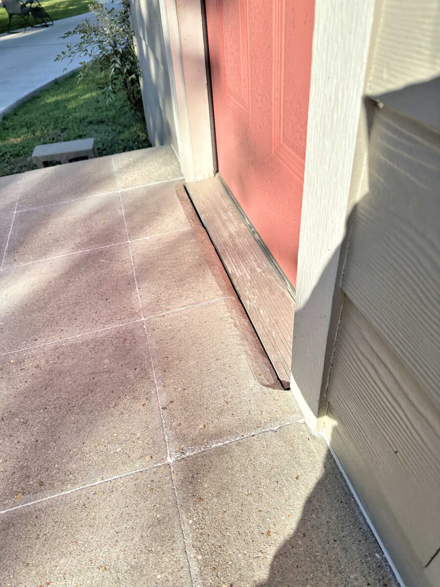 How to fix an exterior concrete step that is higher than the door threshold